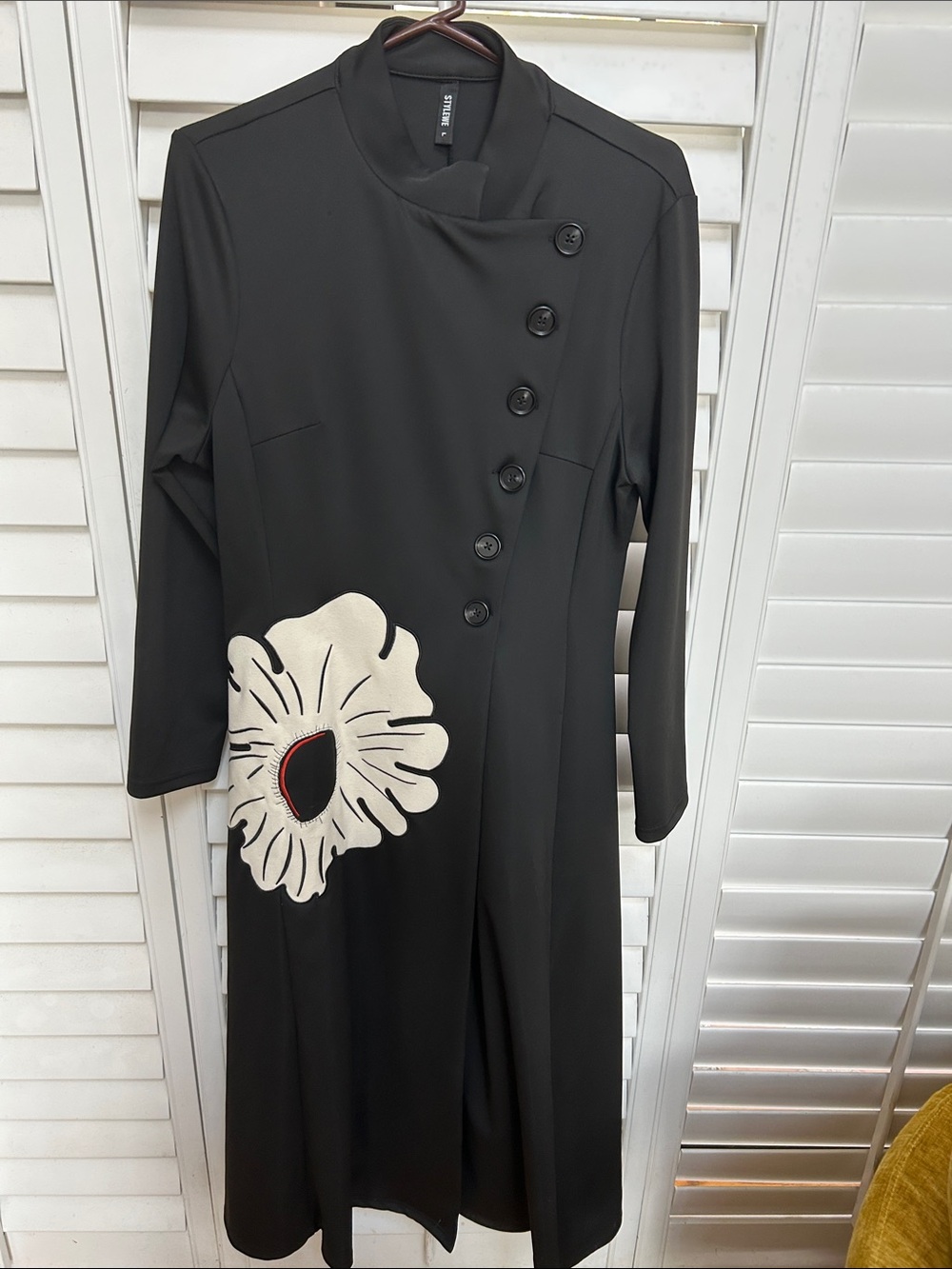 Elegant Black Long Sleeve Dress with Ivory Floral Accent